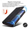 A black leather flip wallet case for an iPhone is shown with magnetic closure and protective features highlighted. Produktbild-Vorschau