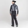 A man wearing ski pants and a long-sleeved shirt, viewed from the back. Voir les images du produit