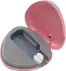 An open pink case with a gray interior holding a blue and clear plastic insert with white tips protruding. Náhľad obrázku produktu
