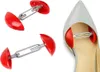 Three red shoe stretchers are shown, with one being used inside a grey high-heeled shoe. Produktbild-Vorschau