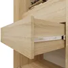 A close-up view of an open drawer in a wooden wardrobe. Produktbild-Vorschau