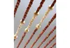 Close-up view of hanging beaded curtain strands. Produktbild-Vorschau