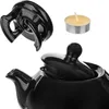 A close-up view of a black ceramic teapot with its lid on, and a separate lid and a tea light candle are shown. Anteprima dell’immagine prodotto