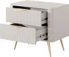 A beige nightstand with two drawers and gold legs, shown from a slightly elevated front-left angle. Produktbild-Vorschau