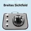A grey pet carrier with a clear bubble window and ventilation holes, set against a light blue background. Text overlays the top of the image. Produktbild-Vorschau