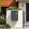 SoBuy Paketbox OGS65-DG geschlossen vor modernem Haus mit Holzfassade Vista previa de la imagen del producto