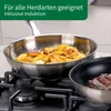 Two frying pans on a stovetop, one with food being cooked. Produktbild-Vorschau