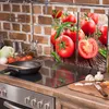 A kitchen counter with a stovetop, cutting board, and ingredients. Produktbild-Vorschau