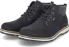 A pair of black winter boots with white soles and gray accents. Produktbild-Vorschau