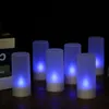 A set of six LED tealights with blue light are arranged on a wooden surface, with books in the background. Produktbild-Vorschau