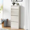 A tall, narrow shoe cabinet with four flip-down drawers stands against a white wall. A woven basket with a striped blanket and pillow sits to the left of the cabinet. Small potted plants are on top of the cabinet. Voir les images du produit