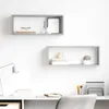 Two wall shelves are mounted on a white wall above a desk with a lamp and office supplies. Náhľad obrázku produktu