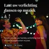 Two people dancing at night with string lights. Náhled obrázku produktu