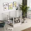 A dog pen set up indoors with a husky dog lying inside, a teddy bear, food bowls, and a humidifier. There are framed pictures of animals on the wall and a large potted plant. Anteprima dell’immagine prodotto
