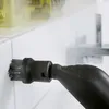 A close-up shot of a steam cleaner nozzle with a brush attachment cleaning a white tiled wall. Produktbild-Vorschau