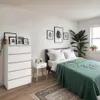 A bedroom scene with a dresser, bed, and nightstand. Produktbild-Vorschau