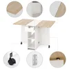 A collage of images showing a white and wood folding kitchen table with drawers and shelves, with close-ups of its features. Voir les images du produit