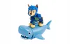 A toy dog riding a toy shark. Produktbild-Vorschau