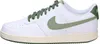 A side view of a white Nike Court Vision Low sneaker with green accents. Produktbild-Vorschau