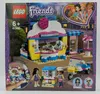 The image shows the LEGO Friends Olivia's Cupcake Cafe playset packaging, featuring the assembled toy, characters, and product details. Náhled obrázku produktu