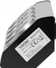A close-up, angled view of a black and silver power strip with multiple outlets and USB ports, showing a label with product information. Anteprima dell’immagine prodotto