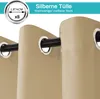 Close-up of beige outdoor curtains with silver grommets hanging on a black rod. Produktbild-Vorschau