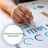 A hand is pointing at a document with charts and graphs. Anteprima dell’immagine prodotto