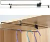 The image shows a retractable closet rod, with the top image being a product shot against a white background and the bottom image showing it installed in a closet holding clothes hangers. Náhľad obrázku produktu