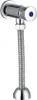 A chrome urinal flush valve with a flexible hose. Anteprima dell’immagine prodotto
