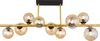 A modern chandelier with multiple glass globes. Náhled obrázku produktu
