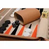 A close-up view of a backgammon board with dice and checkers. Podgląd zdjęcia produktu