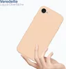 A hand holding a peach-colored phone case. Produktbild-Vorschau