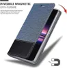 A blue and black flip case for a smartphone is shown partially open, with text and icons highlighting its features. Náhled obrázku produktu