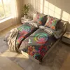 A bedroom scene with two beds featuring colorful mandala-patterned bedding. Produktbild-Vorschau