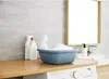 A laundry room scene with cleaning supplies and a washing machine. Náhled obrázku produktu