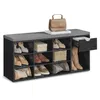 A shoe bench with multiple compartments and a drawer, displaying various shoes and a handbag on top. Náhled obrázku produktu