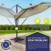 An outdoor patio umbrella with solar lights and instructional graphics. Anteprima dell’immagine prodotto