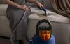 A person is using a carpet cleaner on a stained sofa. Anteprima dell’immagine prodotto
