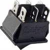 A close-up, angled view of a black electrical switch with silver terminals. Podgląd zdjęcia produktu