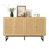 A wooden sideboard with rattan doors is displayed against a white background, with decorative items on top. Náhľad obrázku produktu