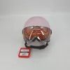 A pink Alpina ski helmet with a visor is displayed against a white background. Anteprima dell’immagine prodotto