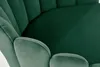 A close-up view of a green velvet chair with a petal-like design. Náhled obrázku produktu