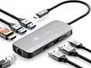 A silver USB-C hub with multiple ports and cables is displayed on a white background. Produktbild-Vorschau