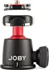 A close-up studio shot of a black and red Joby ball head tripod mount. Produktbild-Vorschau