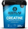 A black and blue tub of BODYLAB Creatine Monohydrate powder. Produktbild-Vorschau