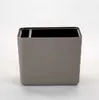 A gray planter with horizontal ridges and a black rim, shown against a white background. Náhled obrázku produktu