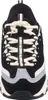 A front view of a black and white Skechers D'Lites sneaker. Produktbild-Vorschau