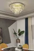A crystal chandelier ceiling light fixture is shown in a room with modern decor. Produktbild-Vorschau