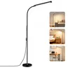 A collage of images showing a black LED floor lamp in different settings: next to a sofa, next to a bed, and on a desk. Produktbild-Vorschau