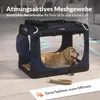 A golden retriever dog lies inside a navy blue pet carrier. The carrier is placed on a light-colored floor. Produktbild-Vorschau